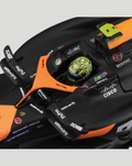 Close up of orange and black 1:43 McLaren MCL38 2024 model cockpit with Norris helmet