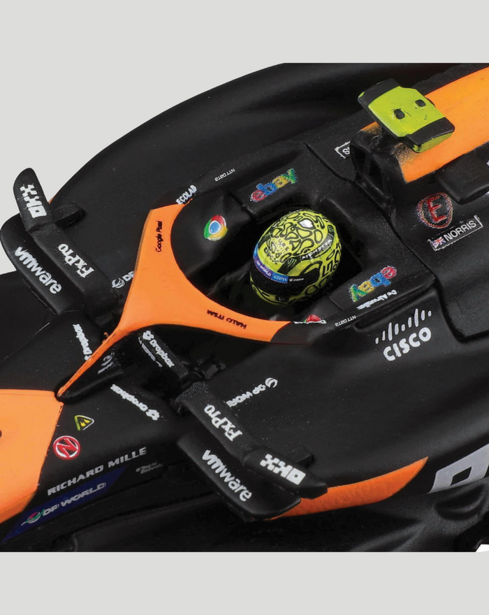 Close up of orange and black 1:43 McLaren MCL38 2024 model cockpit with Norris helmet