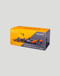 Angled view of the McLaren MCL38 2024 model box with bright orange top and car illustration