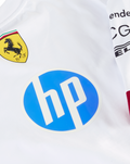 Front of white shirt featuring the yellow Ferrari crest and a large blue HP logo.