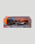 Four 1:43 scale McLaren F1 cars featuring Lando Norris inside a windowed orange and gray collector box