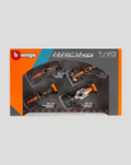 Windowed display of four 1:43 McLaren F1 cars in orange and gray packaging with Lando Norris on the back panel