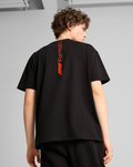 Back view of the black F1 Essential Relaxed Tee showing a vertical red Formula 1 graphic along the upper back.