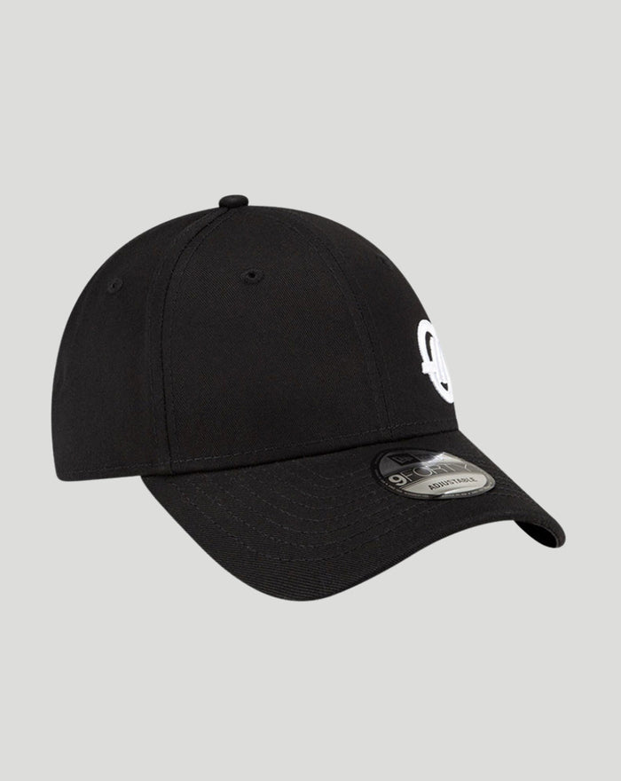Three-quarter view of a black New Era Haas Team cap displaying the white Haas logo on the front and the New Era emblem on the side
