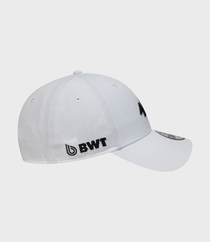 Partial front view of white New Era Alpine Estretch Snapential 9FortyCap with a curved brim