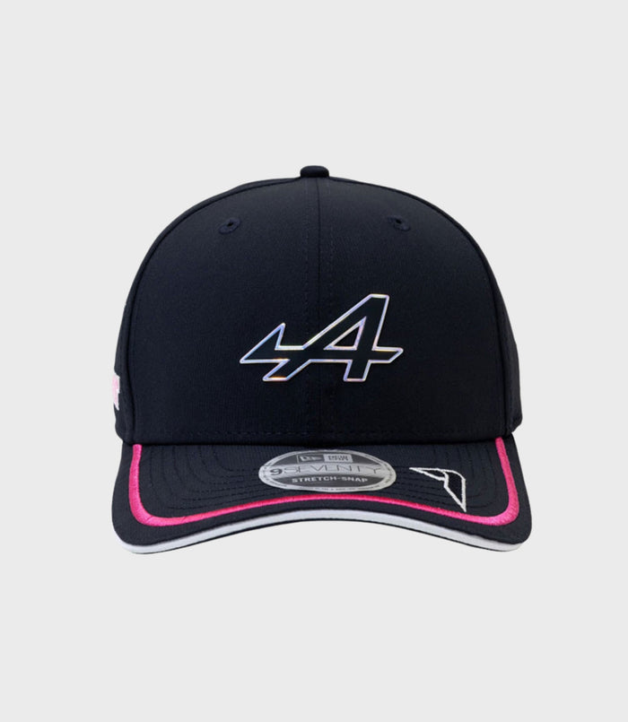 Front view of a navy Alpine Rep Driver 9Seventy cap with a curved brim and top button