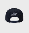 Front view of a navy New Era 9Seventy cap with a white embroidered logo on the crown
