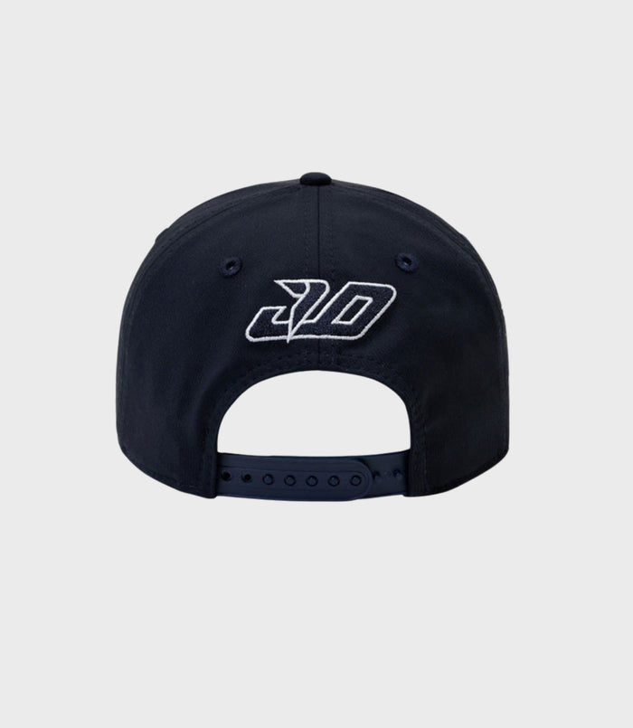 Front view of a navy New Era 9Seventy cap with a white embroidered logo on the crown
