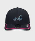 Front view of navy New Era Rep Team 9Seventy Stretch Snap cap with multicolor logo on the front panel and pink edged brim