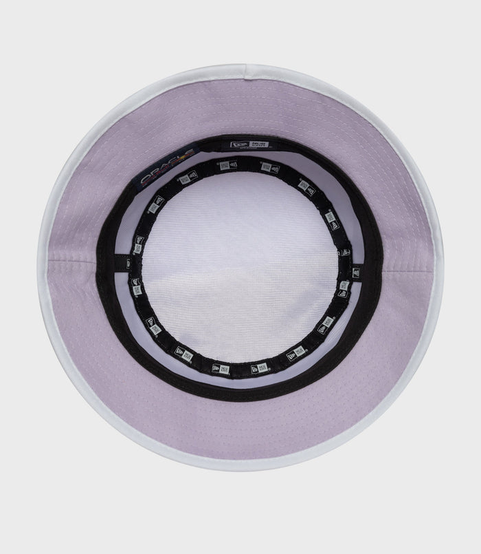 Interior view of pastel purple bucket hat with white trim and visible inner branding.