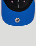 Blue BWT Alpine New Era 9Seventy cap close up curved sapphire visor with pink inner lining and holographic sticker