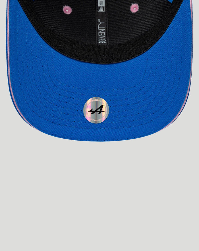 Blue BWT Alpine New Era 9Seventy cap close up curved sapphire visor with pink inner lining and holographic sticker