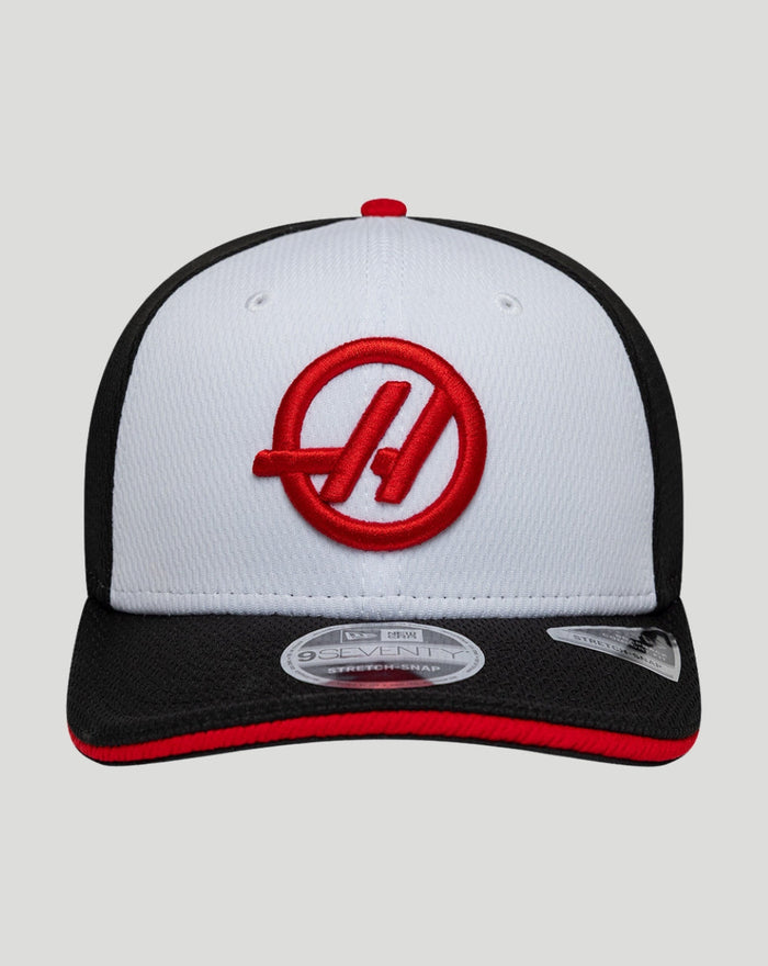 Front-facing view of New Era Haas Team 9Seventy Stretch-Snap cap with white front, black sides, red Haas emblem, and red-trimmed brim.
