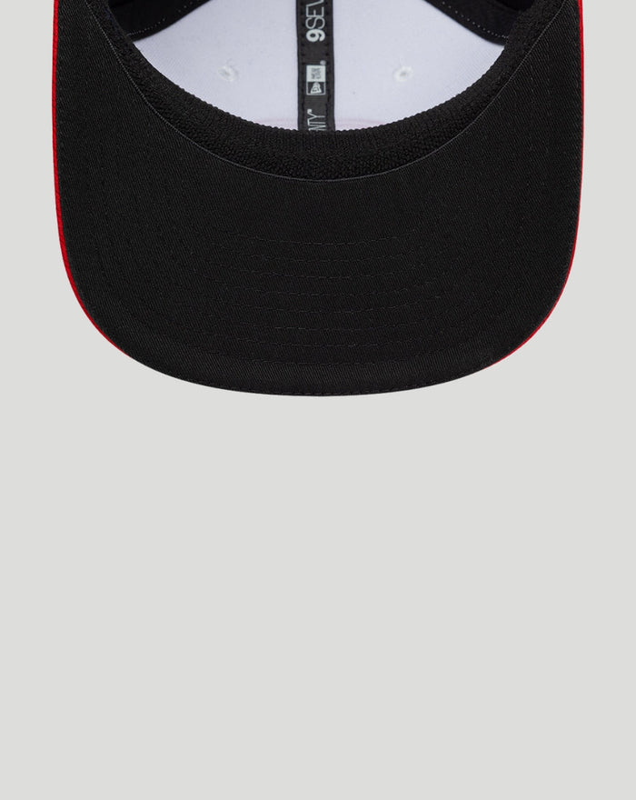 Back interior close up of the cap revealing the adjustable strap and inner sizing tag with black crown and red trim along the brim