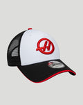 Close up of white front panel cap showing red Haas embroidery and a black curved brim.