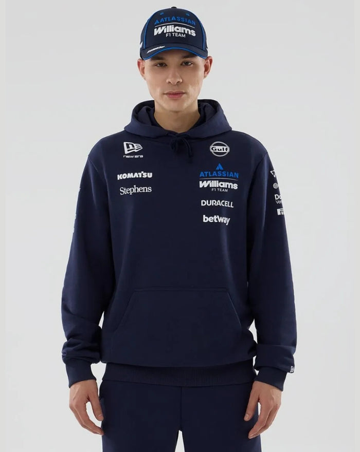 Male model in navy Williams Racing 2026 F1 hoodie with front pocket and team logos on chest and sleeves