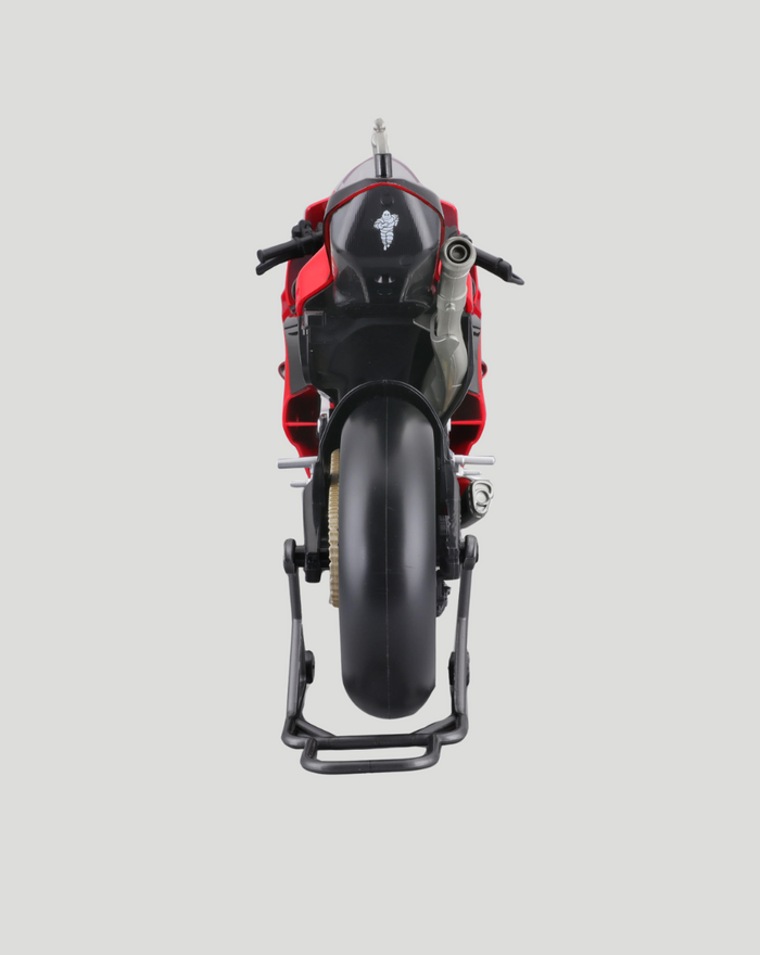 Rear view of red Ducati Lenovo racing bike model on a stand