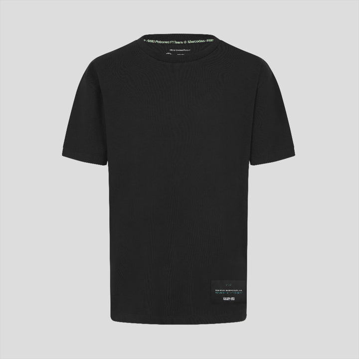 Back view of a black unisex T shirt with small white text along the neckline.