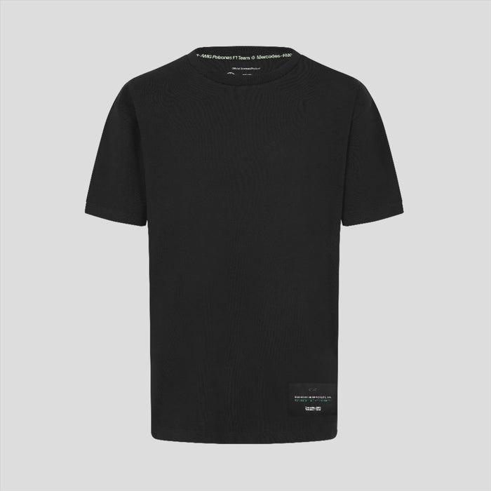 Back view of a black unisex T shirt with small white text along the neckline.