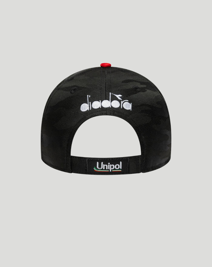 Back view of a black camo cap with a white Diadora logo and Unipol strap