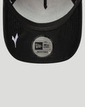 Close up of a black cap brim with a circular New Era adjustable sticker