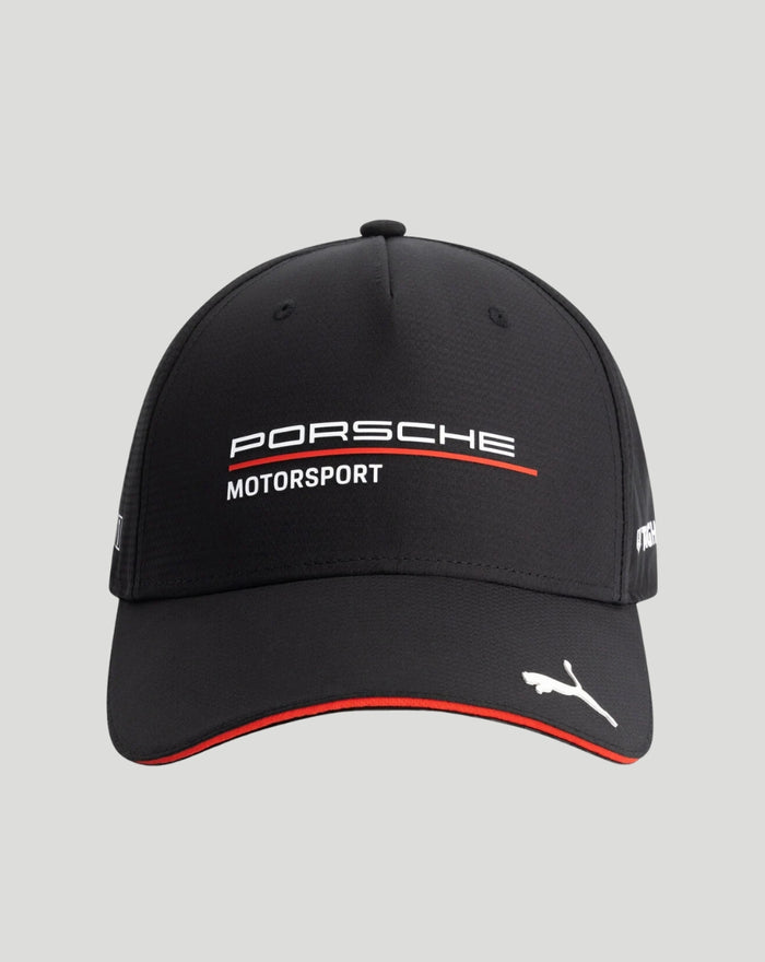 Front view of a black Porsche Motorsport cap with curved brim featuring the Porsche Motorsport logo and a red trim along the edge and a white Puma cat emblem on the brim