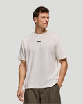 White F1 Fanwear racing division graphic T shirt worn by a male model