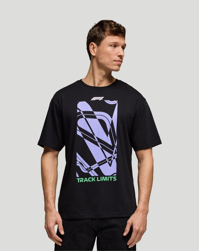Model wearing a black F1 Track graphic T shirt with lavender abstract graphic and Track Limits text at the bottom
