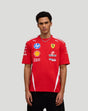 Front view of a man wearing a red Scuderia Ferrari Team Drivers T-shirt with multiple sponsor logos.