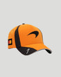 Side view of papaya orange McLaren Norris cap with curved brim and black logo