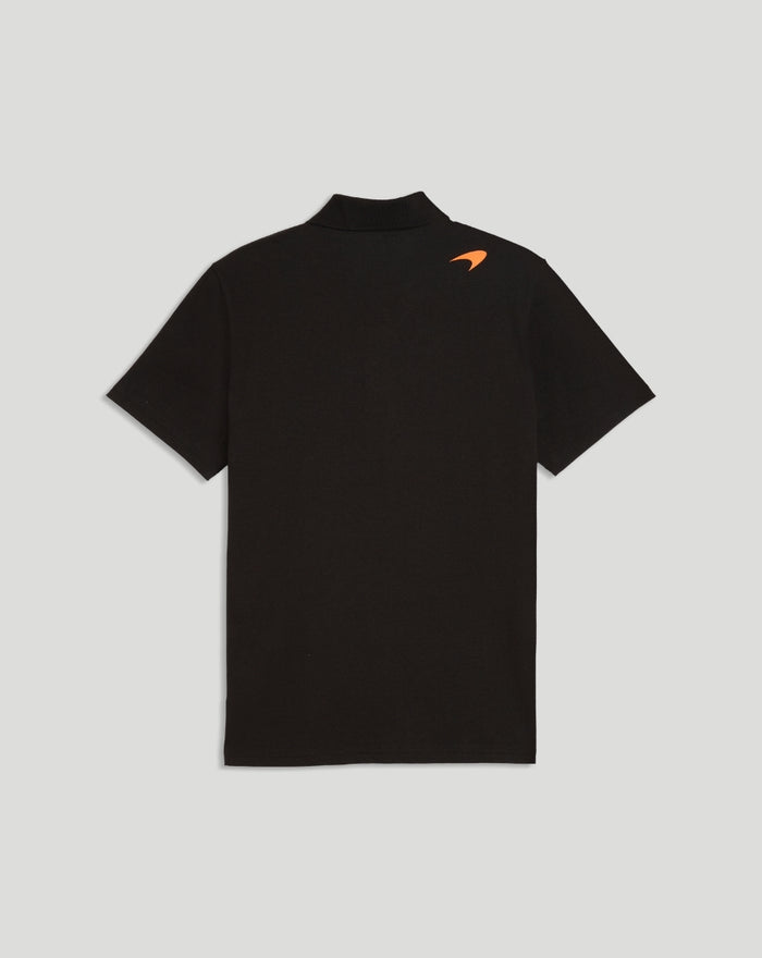 Back view of black McLaren polo with small orange shoulder logo