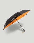 McLaren Racing umbrella in black and orange with automatic opening and carry cord on the handle