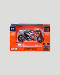 Boxed 1:18 Red Bull KTM Factory Racing motorcycle model in orange packaging with visible bike inside.