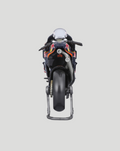 Rear angle view of 1:18 scale Red Bull KTM motorcycle model on a display stand showing detailed livery.