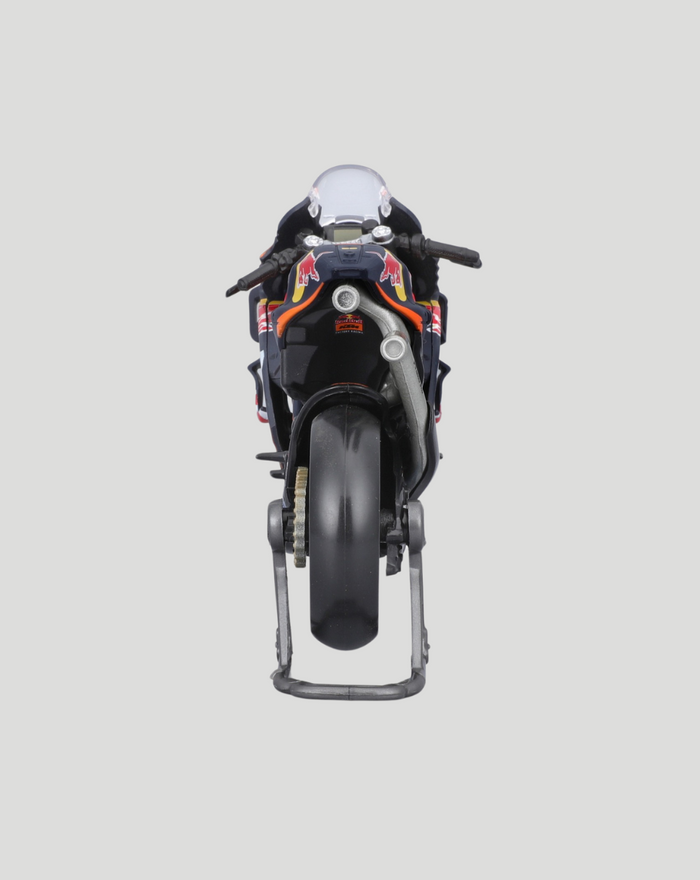 Rear angle view of 1:18 scale Red Bull KTM motorcycle model on a display stand showing detailed livery.