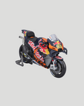1:18 scale Red Bull KTM Factory racing bike with number 33 Binder on a display stand, detailed orange and navy livery.