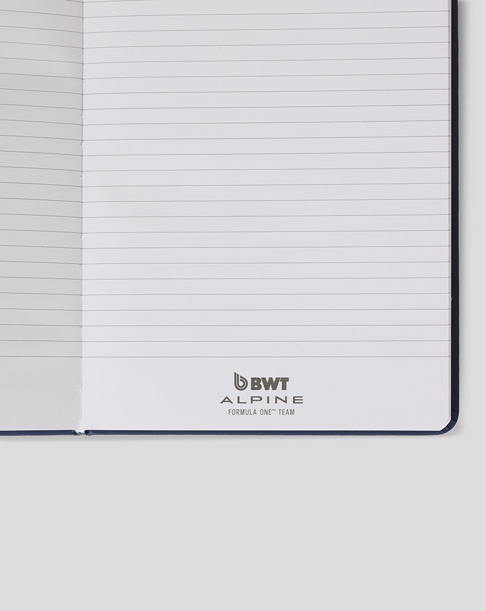 Open notebook showing lined pages and BWT Alpine logo at bottom of the page