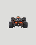 Rear view of the orange and black McLaren MCL38 2024 model with Darktrace branding on the rear wing.