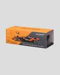 1:24 scale McLaren MCL38 2024 model car with Norris helmet on orange black packaging