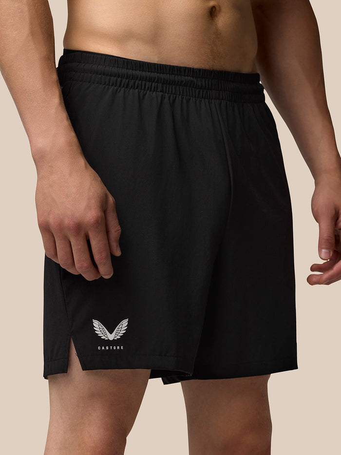 Close up of black Adapt Training 6 inch Shorts with Castore logo on the left thigh
