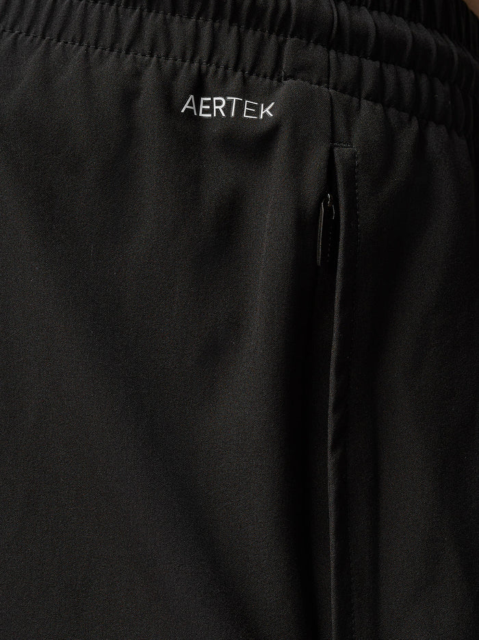Close-up of waistband area of the black Adapt Training shorts showing elastic with internal drawcord and Aertek branding