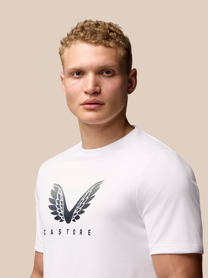 Model wearing white Adapt Training T-Shirt with Castore wings logo on the chest