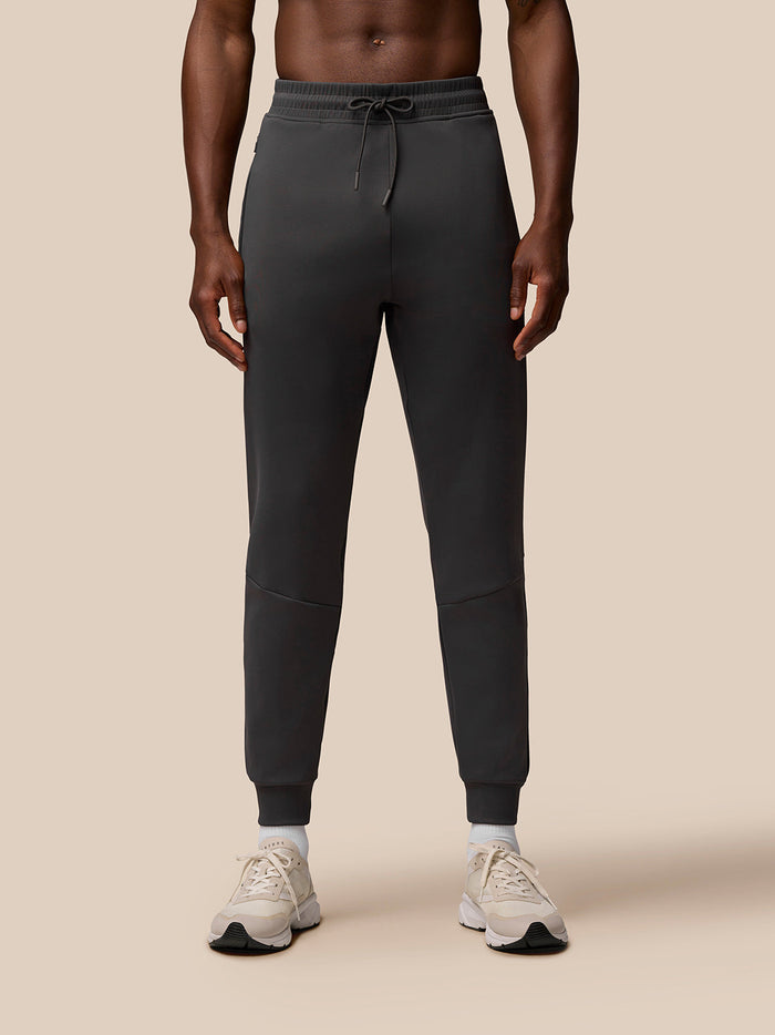 Charcoal Flex Joggers with Castore branding down the left leg and ribbed cuffs