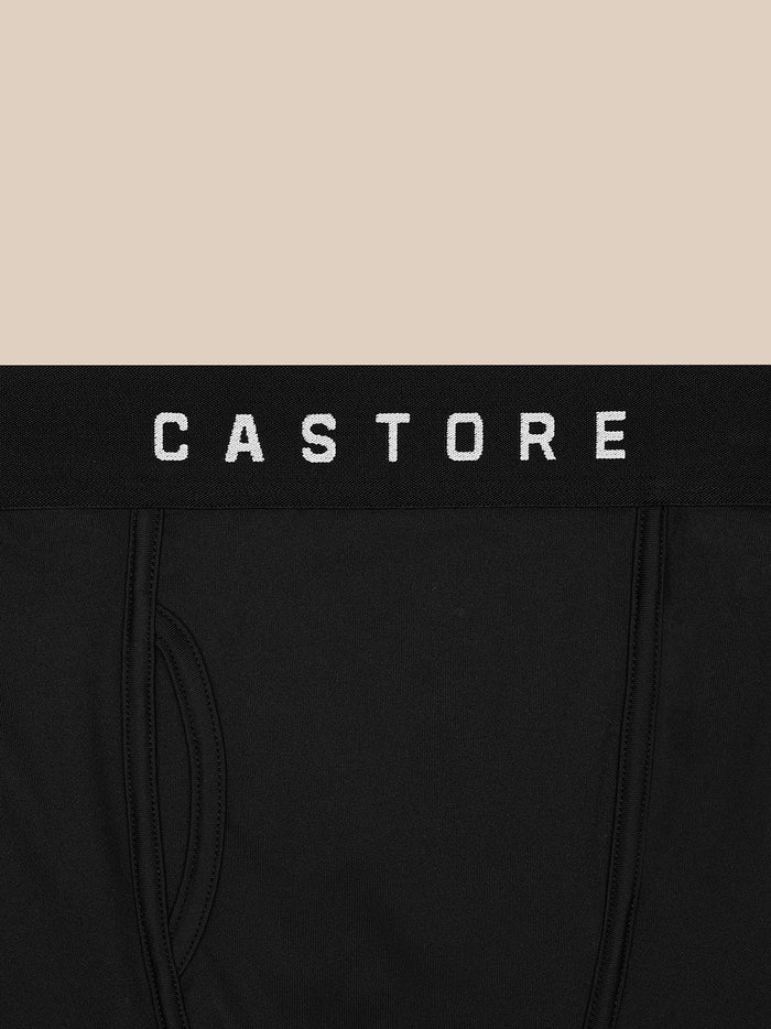 Close-up of black Castore boxer shorts waistband with white CASTORE lettering.