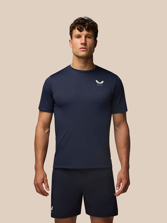 Male model wearing midnight navy Apex Training T Shirt with short sleeves and a small left chest logo.