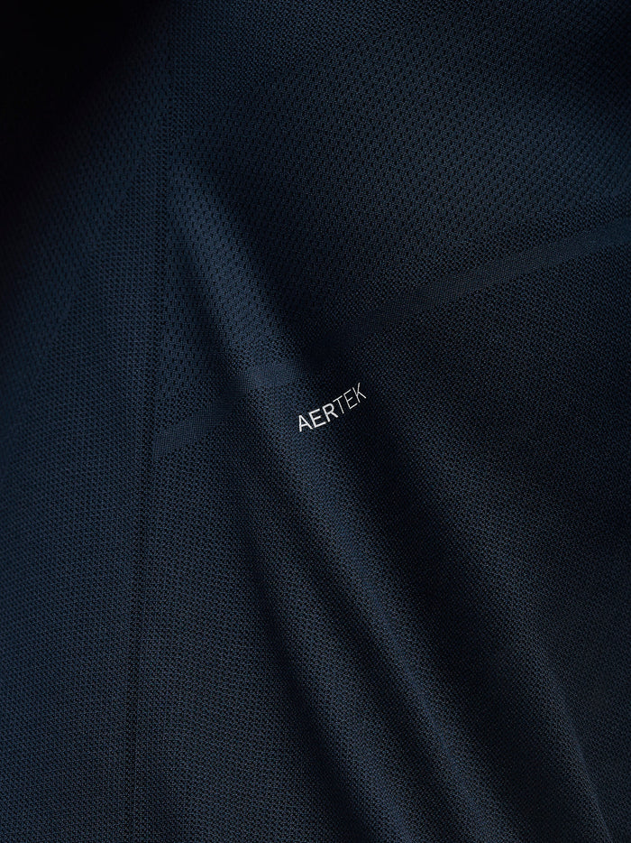 Close up of navy Engineered Knit fabric with visible AERTEK branding.