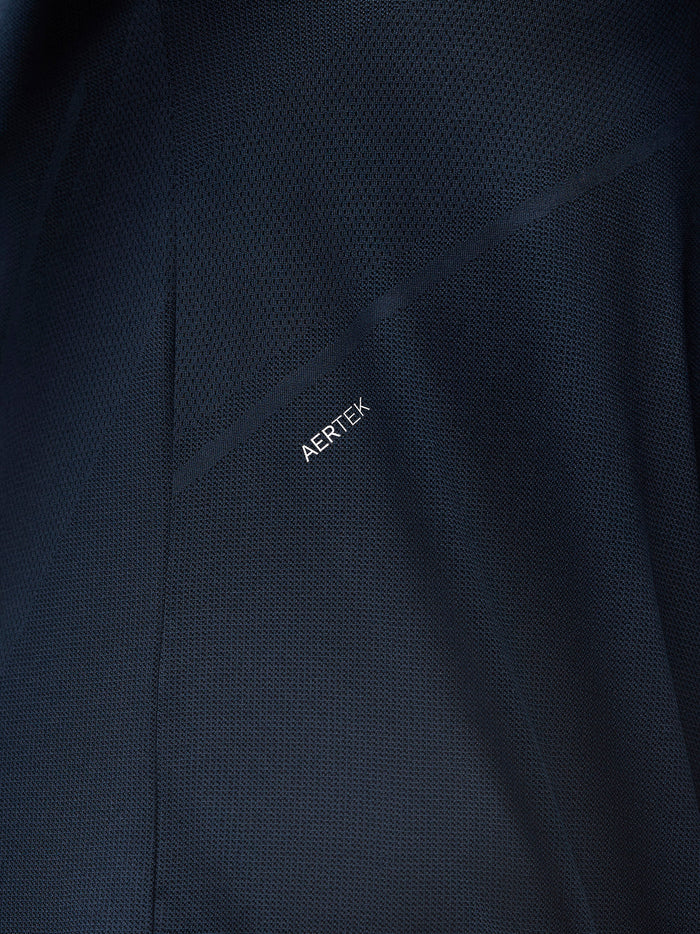 Close up of navy knit fabric showing Aertek branding and textured pattern