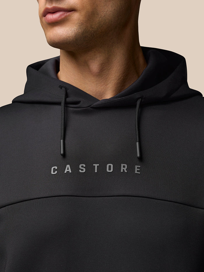 Back view of black Flex Hoodie showing hood and Protek branding at the lower back