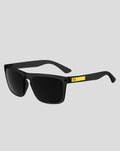 Black McLaren SunGod Renegades sunglasses with yellow accent on the temple shown from a side angle