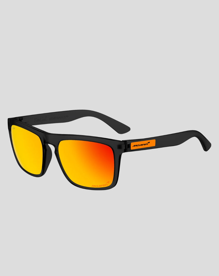 SunGod x McLaren Renegades sunglasses with frosted black frames and yellow to orange mirrored lenses, featuring McLaren logo on the temple.